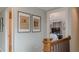 Upstairs hallway with historic newspaper artwork leading to the primary bedroom at 3673 Howard Dr, College Park, GA 30337