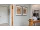 Upstairs hallway with historic newspaper artwork leading to the primary bedroom at 3673 Howard Dr, College Park, GA 30337