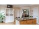 Charming kitchen island featuring a granite countertop, a storage cabinet, and stylish seating at 3673 Howard Dr, College Park, GA 30337