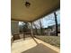 View of the backyard with railing from under the covered back porch at 4373 Trake Way, Ellenwood, GA 30294