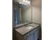 Bathroom featuring vanity with granite counter and modern lighting at 4373 Trake Way, Ellenwood, GA 30294