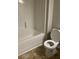 Bathroom featuring a tub with shower and updated toilet at 4373 Trake Way, Ellenwood, GA 30294