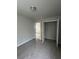 Carpeted bedroom featuring an open closet and neutral paint at 4373 Trake Way, Ellenwood, GA 30294