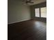 Living room showcasing wood floors, neutral walls, and large windows at 4373 Trake Way, Ellenwood, GA 30294