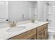 Bathroom with double sinks, a vanity, and a toilet at 6074 Marigold Way, Atlanta, GA 30349