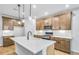 Beautiful kitchen with a center island, modern appliances, wooden cabinetry, and bright lighting at 6074 Marigold Way, Atlanta, GA 30349