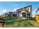 Spacious backyard features lush lawn, covered porch, and a playset at 1405 Lyon Way Dr, Lawrenceville, GA 30044