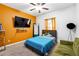 Cozy bedroom with carpet flooring, a large window, and a ceiling fan at 1405 Lyon Way Dr, Lawrenceville, GA 30044