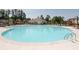 Large community pool featuring many lounge chairs, an awning, and a slide at 1405 Lyon Way Dr, Lawrenceville, GA 30044