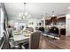 Open-concept kitchen and dining area with stylish decor and stainless steel appliances at 1405 Lyon Way Dr, Lawrenceville, GA 30044