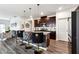 Modern kitchen featuring a breakfast bar with stylish upholstered stools and stainless steel appliances at 1405 Lyon Way Dr, Lawrenceville, GA 30044