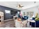 Bright living room showcasing a large TV, cozy furniture and sliding door at 1405 Lyon Way Dr, Lawrenceville, GA 30044