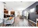 Open floor plan featuring the kitchen, dining area, and living room with wood-look floors at 1405 Lyon Way Dr, Lawrenceville, GA 30044