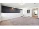 Upstairs loft with neutral carpet and wall paint with view to other rooms at 1405 Lyon Way Dr, Lawrenceville, GA 30044
