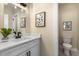 Well-lit bathroom featuring a white vanity with a modern sink and matte black faucet at 1985 Lois Pl, Atlanta, GA 30318