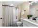 Clean bathroom featuring a shower with curtain, white vanity and black fixtures at 1985 Lois Pl, Atlanta, GA 30318