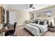 Cozy bedroom featuring a queen bed, a ceiling fan, and three bright windows at 1985 Lois Pl, Atlanta, GA 30318