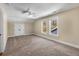 Large bedroom with neutral walls, recessed lighting, ceiling fan, and two bright windows at 1985 Lois Pl, Atlanta, GA 30318
