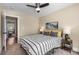 Bright bedroom featuring a ceiling fan, stylish decor, and a comfortable bed with bedside tables at 1985 Lois Pl, Atlanta, GA 30318