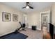 Spare bedroom featuring a ceiling fan, neutral walls, and a door to another room at 1985 Lois Pl, Atlanta, GA 30318