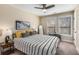 Bright bedroom featuring a striped bed, windows, and neutral walls at 1985 Lois Pl, Atlanta, GA 30318