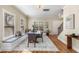 Bright dining room area with hardwood floors, natural light, and an open view to the stairway at 1985 Lois Pl, Atlanta, GA 30318