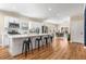 Open kitchen featuring an island with seating and a view into an open-concept dining room at 1985 Lois Pl, Atlanta, GA 30318