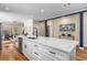 Beautiful kitchen island with marble countertops, seating and stainless-steel dishwasher at 1985 Lois Pl, Atlanta, GA 30318