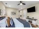 Inviting main bedroom with a view of the ensuite bathroom, ample natural light, and a ceiling fan at 1985 Lois Pl, Atlanta, GA 30318