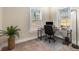Bright home office with two windows, neutral walls, and a modern desk setup at 1985 Lois Pl, Atlanta, GA 30318