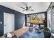 Relaxing screened-in porch with seating, ceiling fan, and views of the backyard at 1985 Lois Pl, Atlanta, GA 30318