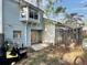 Backyard with a small patio and wood fence at 5916 Dogwood Mnr, Lithonia, GA 30038