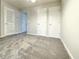 Bedroom with three doors and light gray carpeting at 5916 Dogwood Mnr, Lithonia, GA 30038