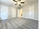 Spacious bedroom boasting gray carpet, three large closets, and neutral walls at 5916 Dogwood Mnr, Lithonia, GA 30038