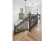 Open staircase featuring hardwood floors, dark stained rails and large window at 770 Bedford Oaks Dr, Marietta, GA 30068