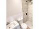 Updated bathroom features include a modern sink, toilet, and shower with large gray tiles at 115 Hollybrook Rd, Atlanta, GA 30349