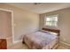 Bedroom with neutral colors with wood flooring and a window at 115 Hollybrook Rd, Atlanta, GA 30349