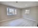 Bright bedroom featuring wood-look floors and a bay window at 115 Hollybrook Rd, Atlanta, GA 30349