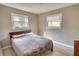 Bedroom with neutral colors with wood flooring and two windows at 115 Hollybrook Rd, Atlanta, GA 30349
