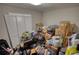 Bedroom cluttered with personal items and boxes at 115 Hollybrook Rd, Atlanta, GA 30349