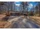 Charming single-story home with a brick facade and long driveway at 115 Hollybrook Rd, Atlanta, GA 30349