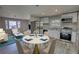 The kitchen has stainless steel appliances and wood flooring, dining area and living room at 115 Hollybrook Rd, Atlanta, GA 30349