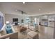 Bright living room features modern finishes, a sliding door to the backyard, and an open floor plan at 115 Hollybrook Rd, Atlanta, GA 30349