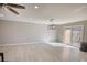 Open living room with sliding doors and modern light fixture with tile backsplash at 115 Hollybrook Rd, Atlanta, GA 30349
