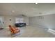 Open living room featuring a large window, tile backsplash, and a contemporary design at 115 Hollybrook Rd, Atlanta, GA 30349