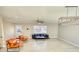 Bright living room boasts modern light fixture, ceiling fan, and stylish furniture set against neutral walls at 115 Hollybrook Rd, Atlanta, GA 30349