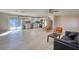 Open floor plan showcases a kitchen and living room with a sliding patio door leading to the backyard at 115 Hollybrook Rd, Atlanta, GA 30349