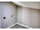 Neutral-toned room featuring sleek flooring and modern outlets at 115 Hollybrook Rd, Atlanta, GA 30349