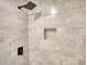 Modern shower with neutral tile, rain shower head, and convenient built-in niche at 115 Hollybrook Rd, Atlanta, GA 30349