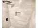 Detailed shot of the tiled shower with a built in shelf and a rain shower head at 115 Hollybrook Rd, Atlanta, GA 30349